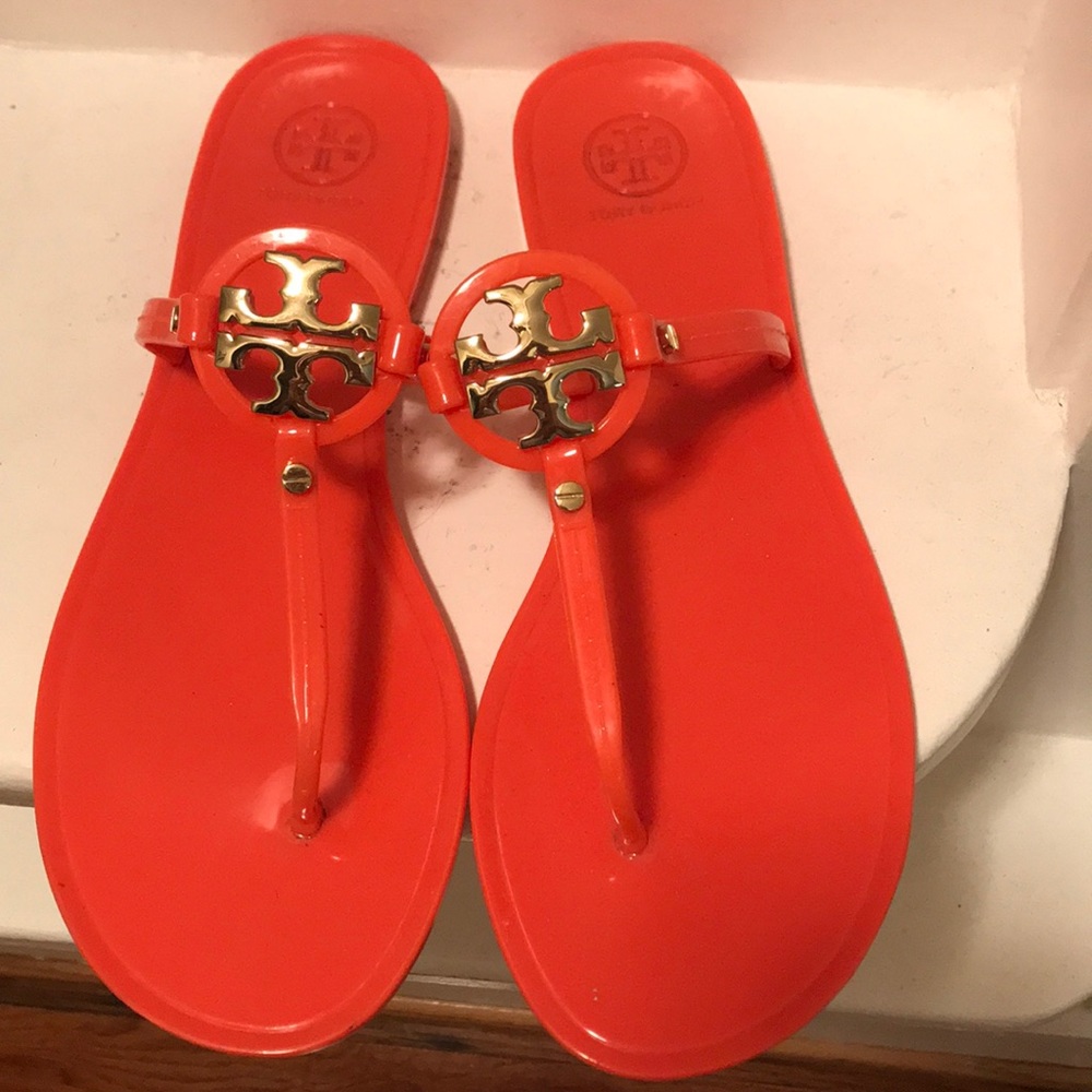 Tory Burch sandals with a gold emblem